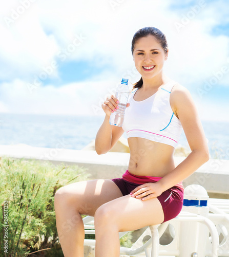 Sporty and beautiful girl doing sports outdoor. Gym, fitness, healthy lifestyle.