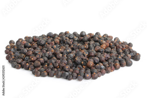 heap of black juniper berries isolated on white background