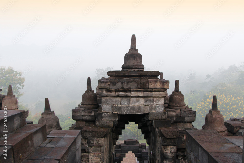 Borobudur Temple with the mysteries forest surrounding at dawn, Yogyakarta, Indonesia Borobudur Temple with the mysteries forest surrounding at dawn, Yogyakarta, Indonesia