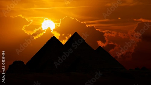 Egypt: The Great Pyramids Of Giza at Sunset, Time Lapse with Red Sun and Clouds, Cairo