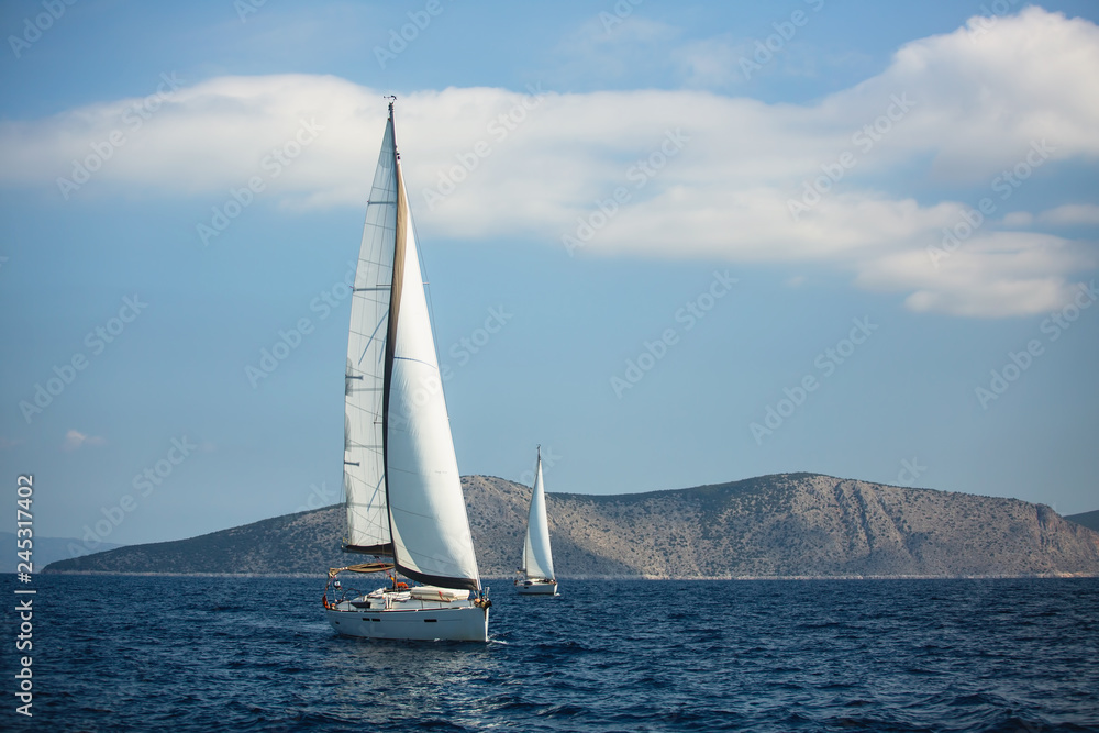 Sailing luxury yacht boats on the Aegean Sea.