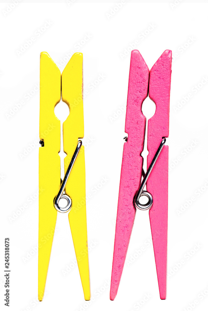 yellow and pink clothes pegs