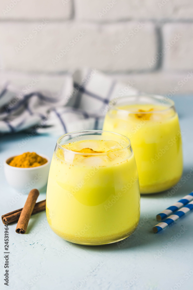 Iced turmeric latte. Selective focus, space for text. Iced turmeric latte. Selective focus, space for text.