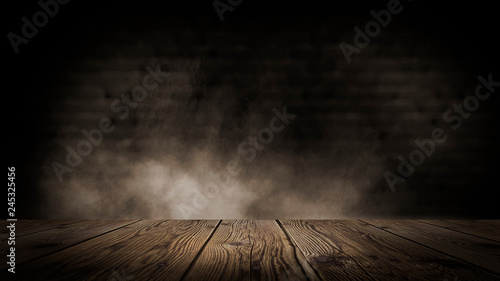 Wooden table in a dark room.