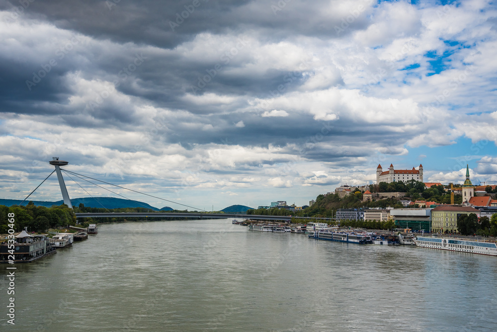 Cityscape of Bratislava with the SNP bridge over Danube river and castle. Bratislava, Slovakia