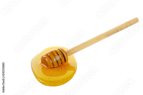 wooden spoon with honey isolated on white background