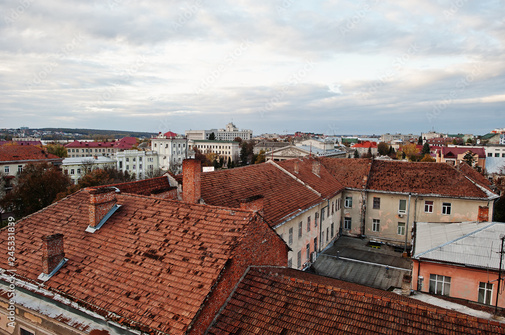 View of old city with buildings red tile roof.
