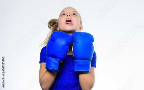 Be strong. Sport upbringing. Upbringing for leadership and winner. Strong child boxing. Sport and health concept. Boxing sport for female. Girl child with blue gloves posing on white background