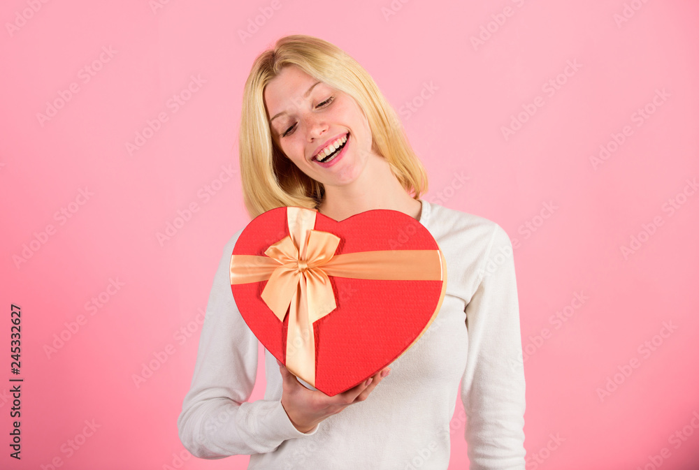 Woman hold heart shaped gift box. Excited about valentines day gift. Every girl would love on valentines day. Romantic surprise gift for her. Heart melting valentines day gifts that every girl wants Woman hold heart shaped gift box. Excited about valentines day gift. Every girl would love on valentines day. Romantic surprise gift for her. Heart melting valentines day gifts that every girl wants