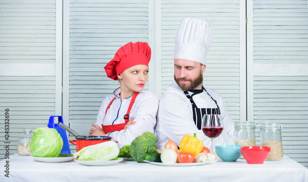 Culinary battle concept. Woman and bearded man culinary show competitors. Who cook better. Ultimate cooking challenge. Culinary battle of two chefs. Couple compete in culinary arts. Kitchen rules Culinary battle concept. Woman and bearded man culinary show competitors. Who cook better. Ultimate cooking challenge. Culinary battle of two chefs. Couple compete in culinary arts. Kitchen rules