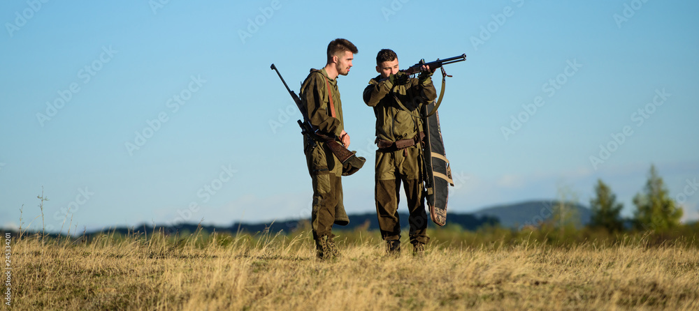 Hunting skills and weapon equipment. How turn hunting into hobby. Friendship of men hunters. Army forces. Camouflage. Military uniform fashion. Man hunters with rifle gun. Boot camp. Hunting target Hunting skills and weapon equipment. How turn hunting into hobby. Friendship of men hunters. Army forces. Camouflage. Military uniform fashion. Man hunters with rifle gun. Boot camp. Hunting target