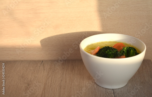 Soup in a white Kuban on a light background.