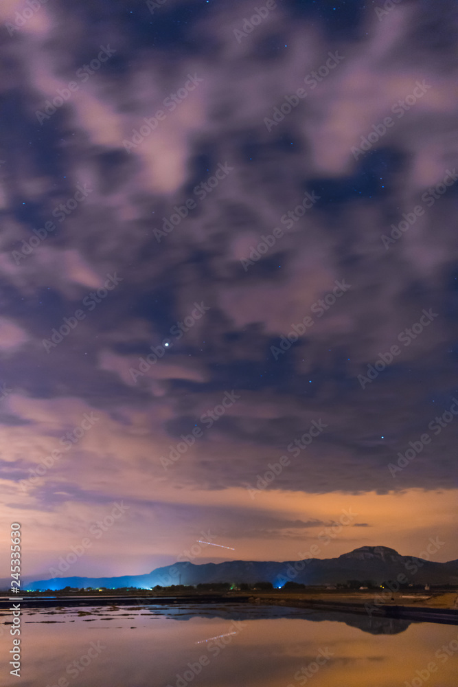 Fototapeta premium Starry sky reflected in the water