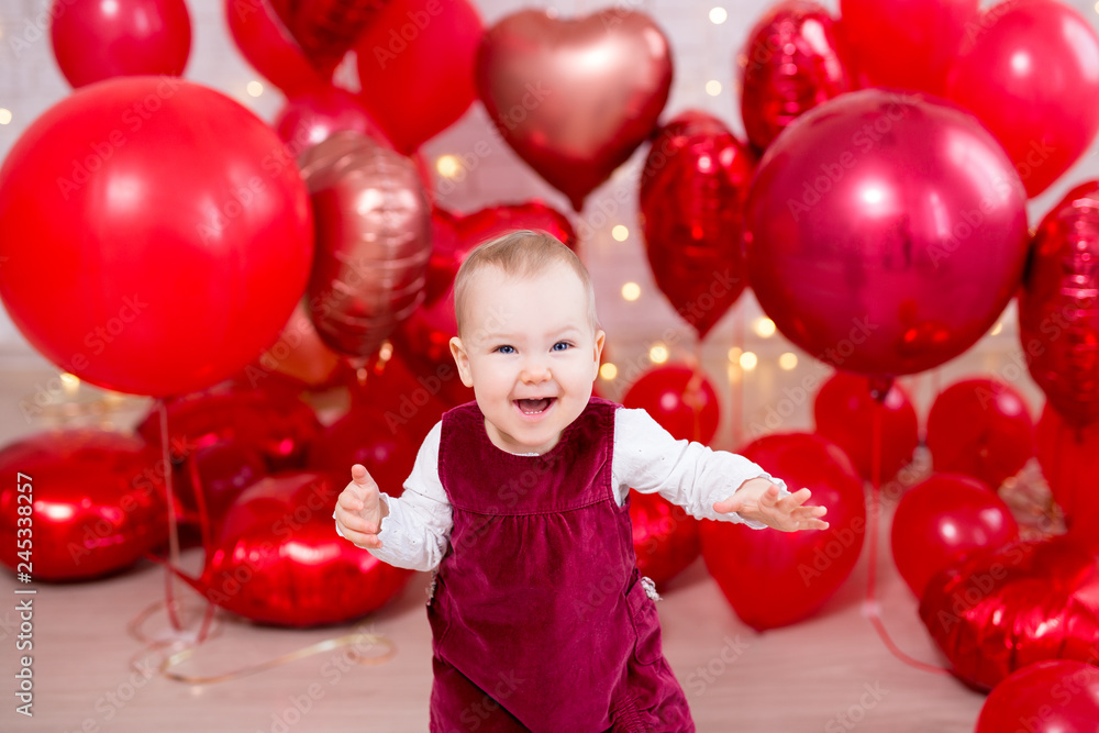 valentine's day concept - portrait of funny little baby girl with red balloons valentine's day concept - portrait of funny little baby girl with red balloons