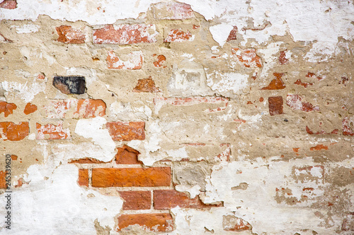 Beige Plastered Brickwall With Chipped Stucco Pieces. Red Textured Brick Wall With Damage Surface. Old Grunge Abstract Background.