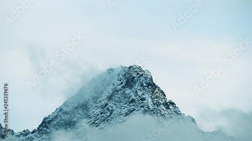 Top of the Mountain (Alps) covered with snow and clouds in Austria Tyrol photo