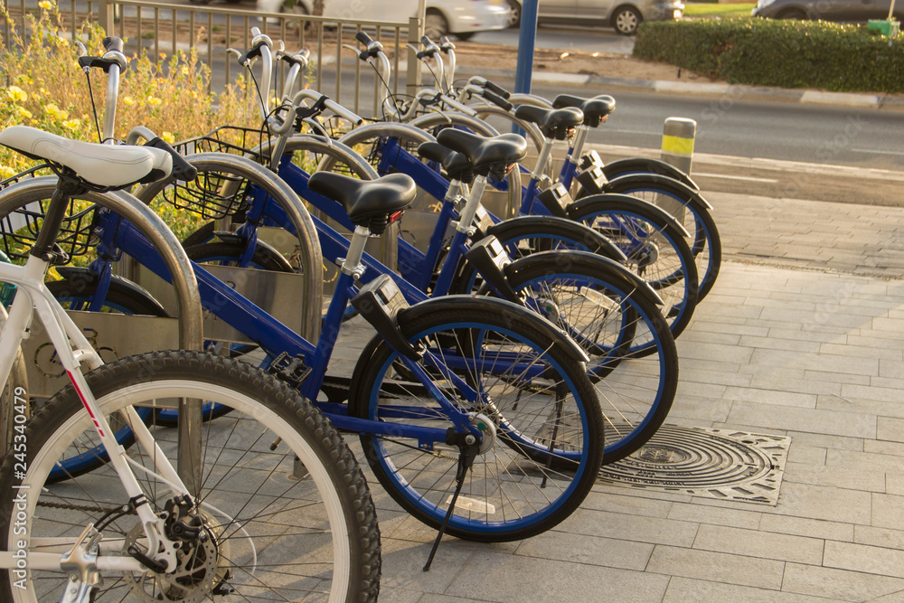Obraz premium Sunset parking for bicycles