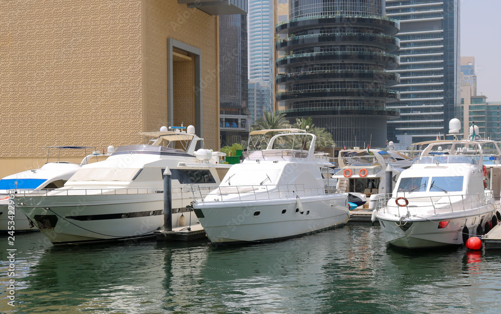 Luxury Yachts moored in a harbour of Dubai.