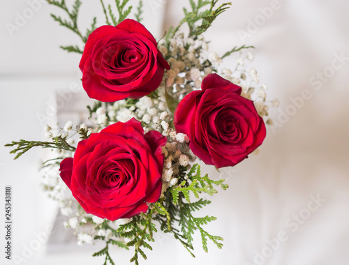 red roses bouquet detail with white background and space to write