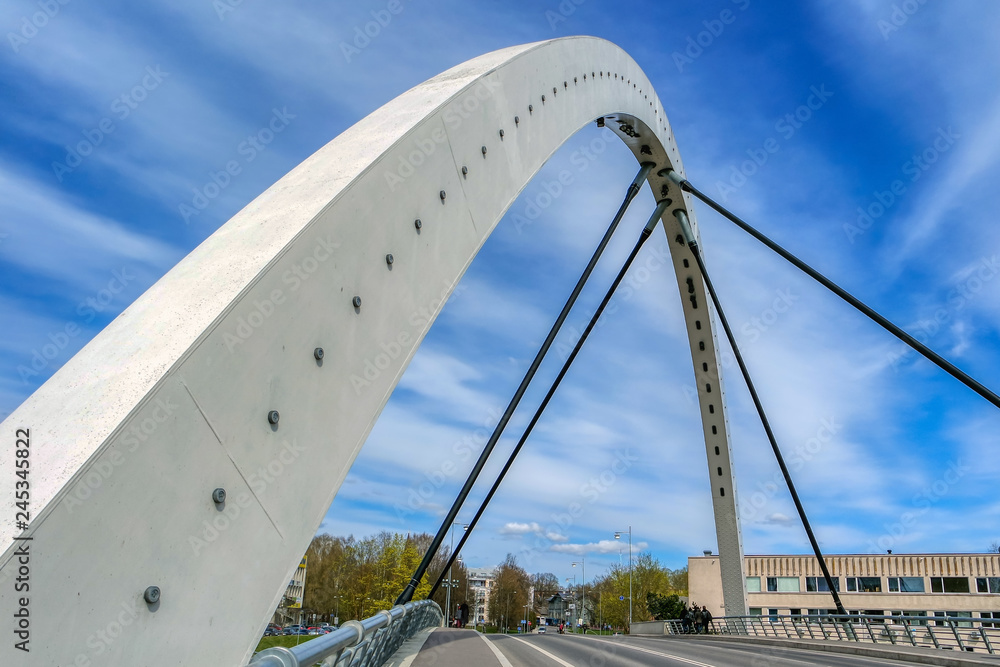 Modern Freedom bridge over river Emajogi in Tartu, Estonia