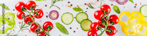 Fototapeta Naklejka Na Ścianę i Meble -  Vegan healthy food concept. Ingredients cooking spring vitamin salad. Fresh vegetable simple pattern, layout with tomatoes, onions, herbs and spices on white background. Top view banner copy space