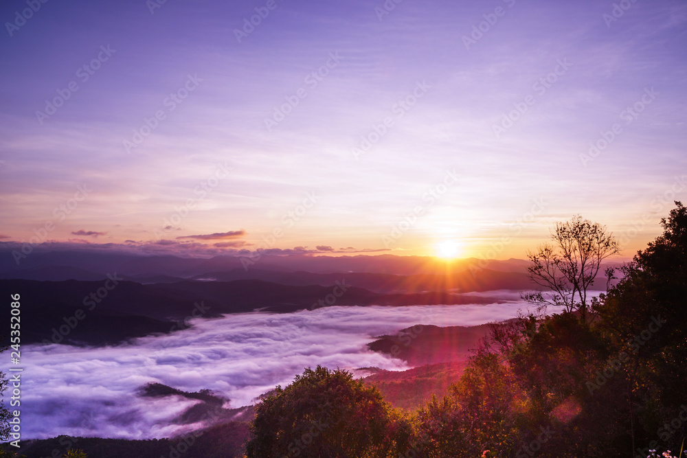 The sun rises after the mountain With fog on the front The sun rises after the mountain With fog on the front