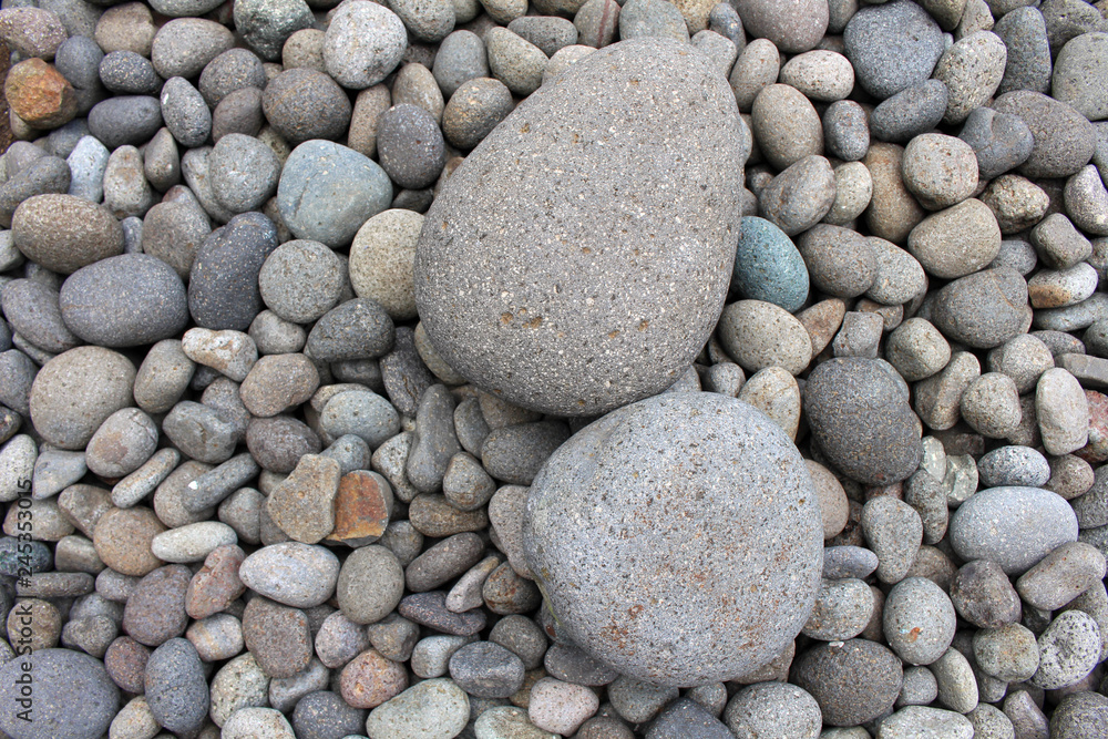 Big stones among smaller pebbles, in the garden. Big stones among smaller pebbles, in the garden.