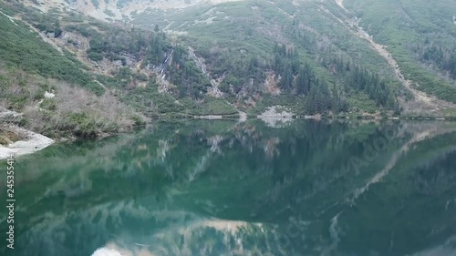 Famous polish landscape - aerial view to mountain lake Morskie Oko with clouds reflect, Tatra Mountains, Poland