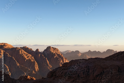 Scenic rocky peaks against a blue sky. Mount Sinai (Mount Horeb, Gabal Musa). Sinai Peninsula of Egypt. Famous touristic place and travel destination in Egypt