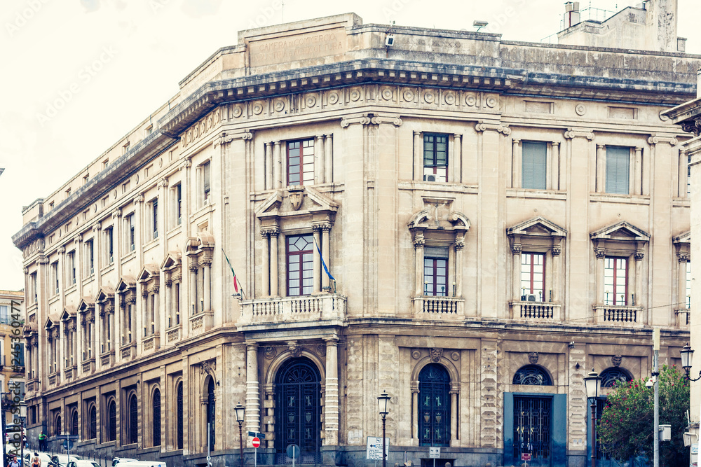 Naklejka premium Beautiful cityscape of Italy, historical street of Catania, Sicily, facade of old building.