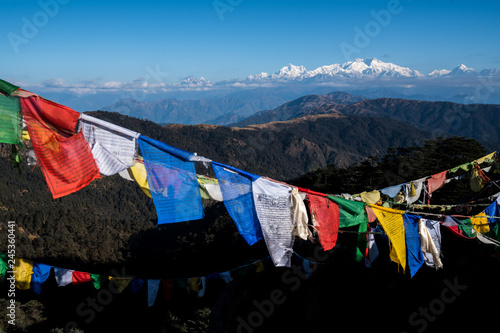 Tibetan prayer flag or Lung ta and Kangchenjunga high mountain range view