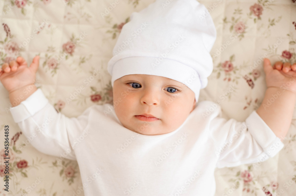 Portrait of a crawling baby on the bed in her room Portrait of a crawling baby on the bed in her room
