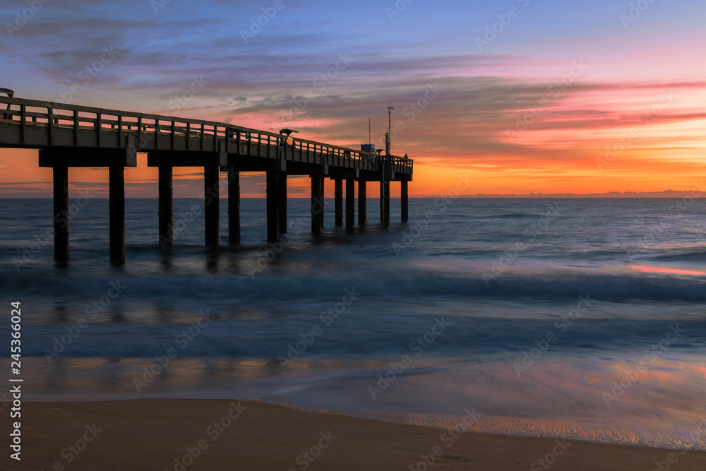 Sunrise over the Atlantic Ocean at the St. Augustine Beach Pier in St. Augustine, Florida