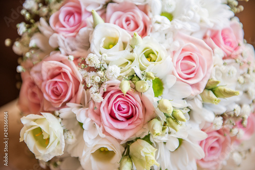 beautiful wedding bouquet pastel pink rose and white foliage 