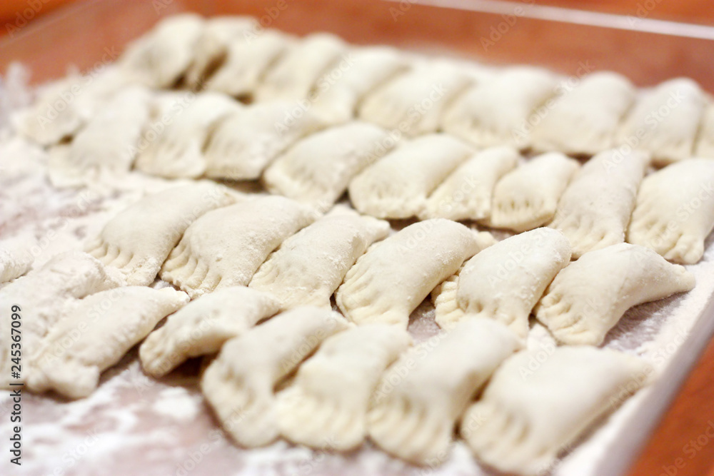 Raw dumplings on a tray Raw dumplings on a tray