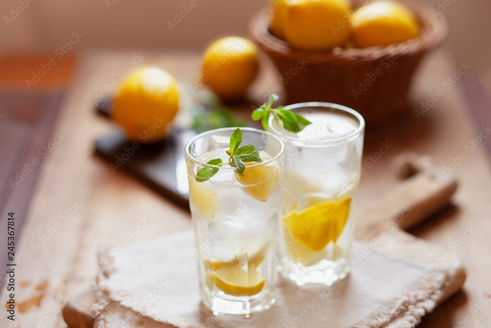 Refreshing summer drink with lemon, mint and ice copy space Refreshing summer drink with lemon, mint and ice copy space
