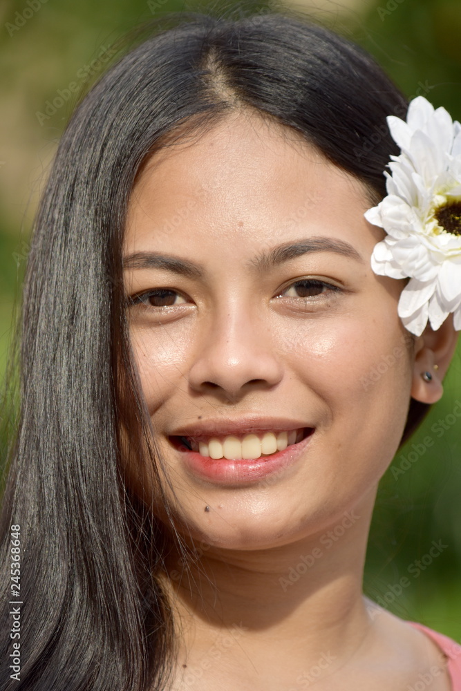 Attractive Minority Female Smiling With Flowers Attractive Minority Female Smiling With Flowers