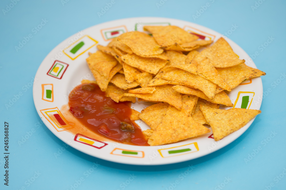 Tortilla with Salsa dip ,Potato chips and red sauce