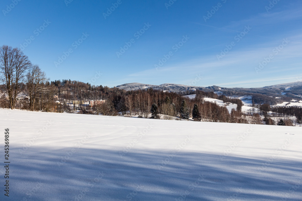 Clear sunny sky with a beautiful landscape on snow covered trees in a evanescent Christmas morning in the mountains. Clear sunny sky with a beautiful landscape on snow covered trees in a evanescent Christmas morning in the mountains.