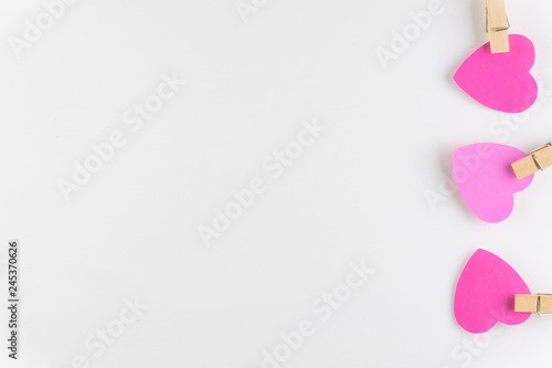 Hand-made pink love hearts isolated on white wooden background, Happy valentine's day. holiday background, Flat lay, top view, copy space