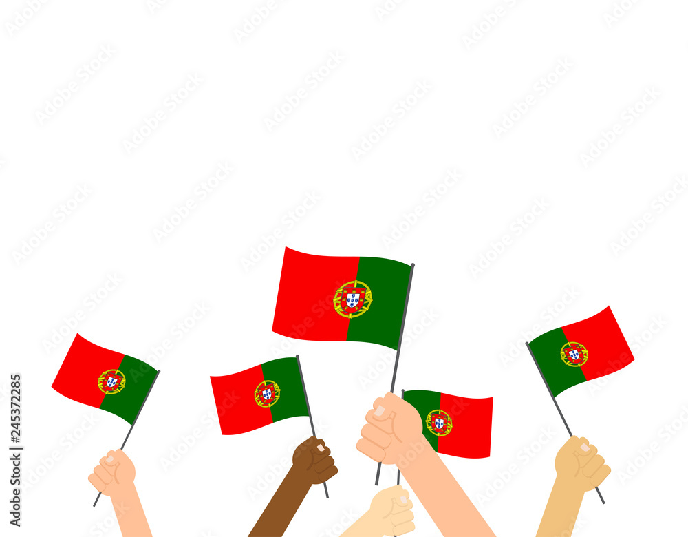 Hand holding Portugal flags isolated on white background Hand holding Portugal flags isolated on white background
