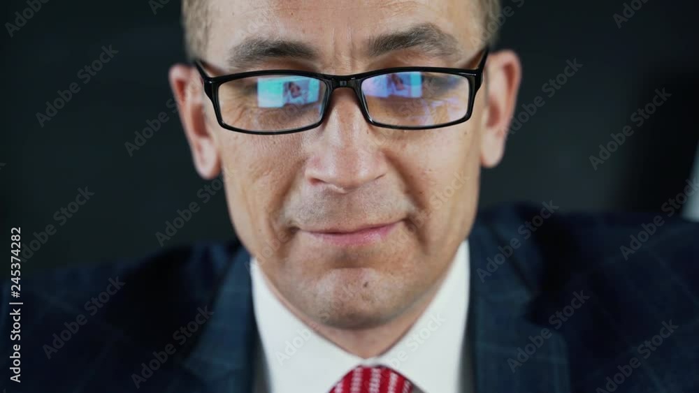 Man businessman or lawyer sitting at work in front of a laptop. Man businessman or lawyer sitting at work in front of a laptop.