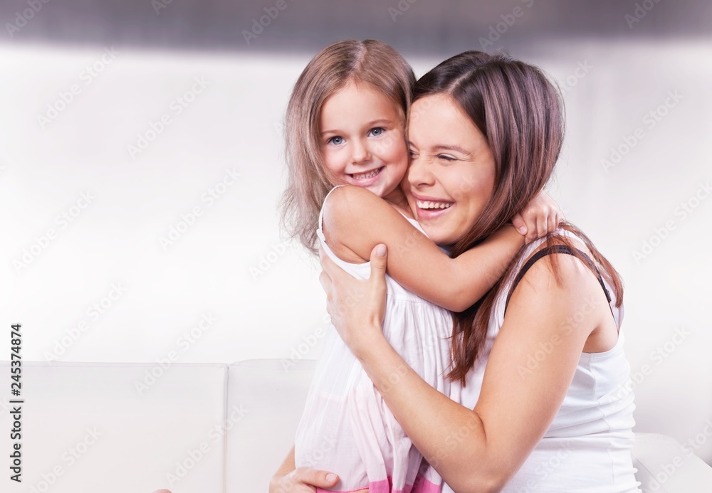 Happy Mother and daughter hugging Happy Mother and daughter hugging