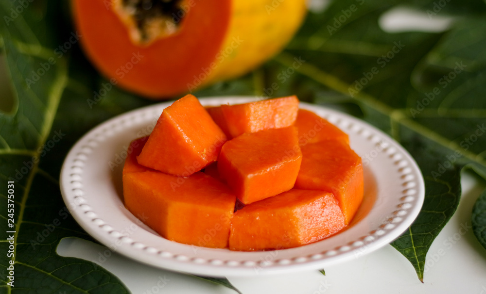 Papaya fruit on leaf background. Papaya fruit on leaf background.