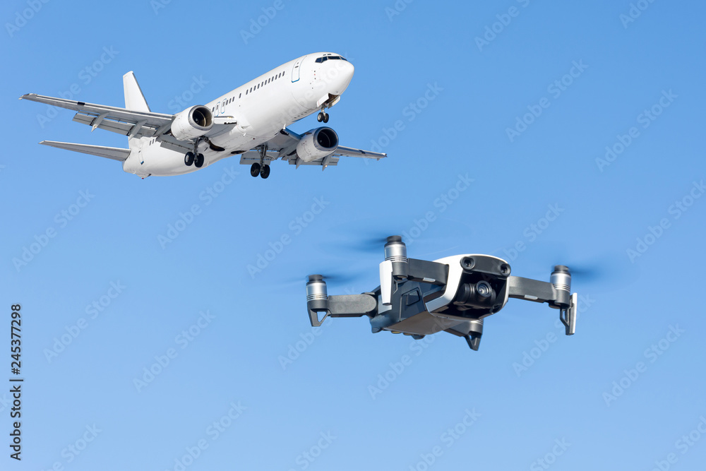 Drone flying near commercial airplane in the airport. Drone flying near commercial airplane in the airport.
