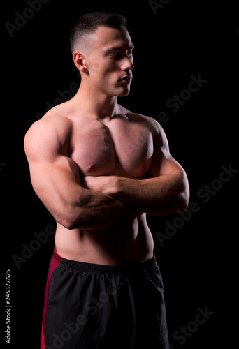 Young strong man isolated