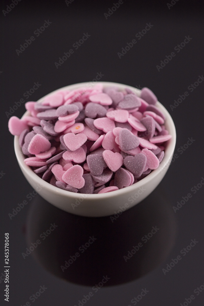 Purple ,Pink Candy Hearts,Colorful sweetss, sprinkle in a porcelain bowl Purple ,Pink Candy Hearts,Colorful sweetss, sprinkle in a porcelain bowl