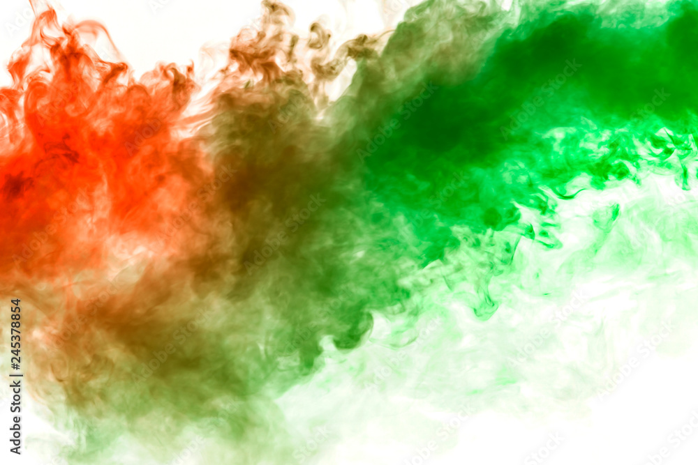 Fototapeta premium The texture of red smoke is like a watercolor on a white background with transitions of matter between green and orange like a chemical reaction.