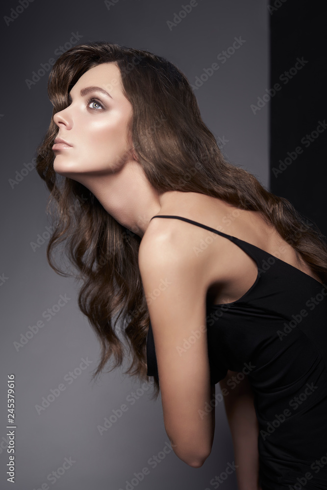 Fashion photo of beautiful lady in black dress.