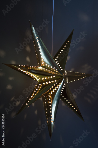 Golden star ornaments on Christmas tree,in Bistrita, Romania